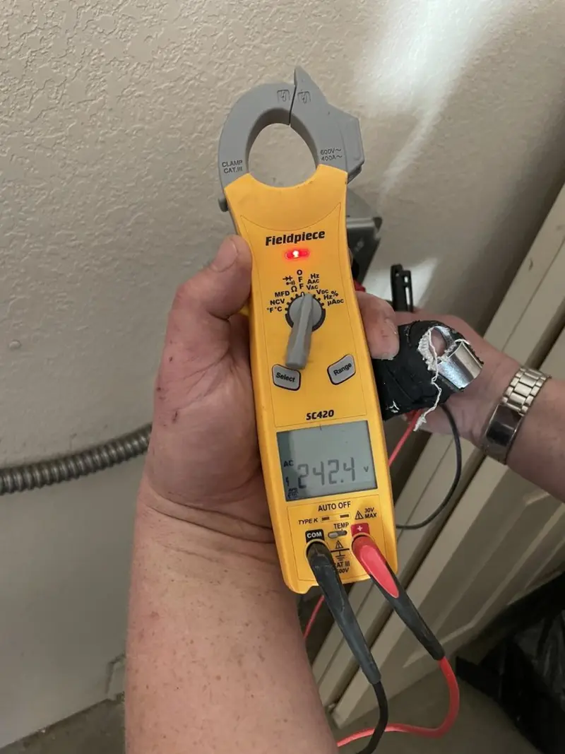 Voltage testing with clamp meter during Electrical Installation Services in Peralta